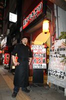 Kotoarashi after retirement outside his restaurant