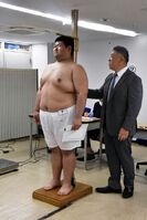 Urayama gets measured upon joining professional sumo (c. 2025)