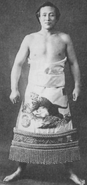 Takenosato poses with his kesho-mawashi