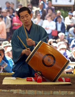 Jiro demonstrates taiko drumming at a regional tour (c. 2009)