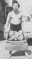 Sakahoko poses with his kesho-mawashi (c. 1963)