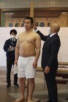 Suyama gets measured upon joining sumo (c. 2022)