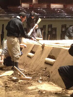 Jiro carries out the dohyo building, his expertise (c. 2013)