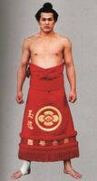 Tamaryu poses with his kesho-mawashi