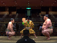 Omatsuda (right) prepares for his upcoming match (c. 2007)