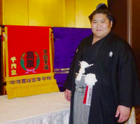 Chiyoo gets presented with his kesho-mawashi (c. 2013)