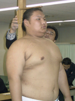 Maenoyu gets measured upon joining sumo (c. 2004)