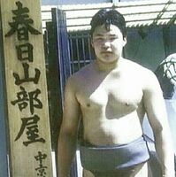 Kitakasuga stands outside of his stable (c. 1999)