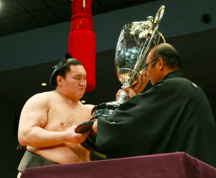 Rehabilitated sumo wrestler repays stablemaster with 1st