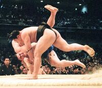Hananokuni gets thrown by Yokozuna Chiyonofuji (c. 1990)