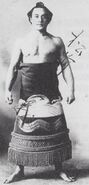 Matsumaeyama poses with his kesho-mawashi