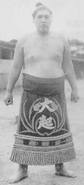 Otachi poses with his kesho-mawashi