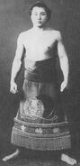 Matsuragata poses with his kesho-mawashi
