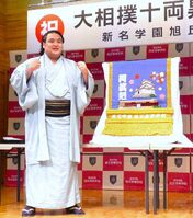 Onokatsu presented with his kesho-mawashi (c. 2024)