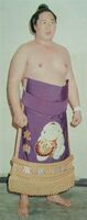 Maruyama poses with his kesho-mawashi (c. 1976)