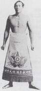 Tsushimanada with his kesho-mawashi