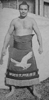 Myobudani poses with his kesho-mawashi (c. 1967)