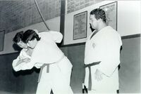 Hakusan (right) after retirement as a judo master (c. 1987)