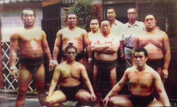 Hoshikabuto outside his stable with his disciples