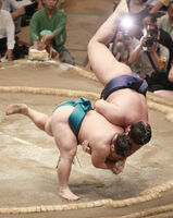 Tochinowaka gets thrown by the much smaller Sagatsukasa (c. 2011)