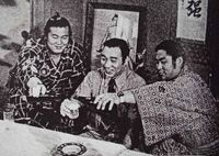 Adachi (left) celebrates promotion to Juryo (c. 1975)