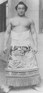 Rikidozan poses with his kesho-mawashi