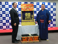 Higonojo presented with his kesho-mawashi (c. 2013)