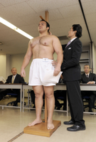 Osunaarashi gets measured upon joining professional sumo (c. 2011)