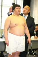 Mitakeumi gets measured upon joining professional sumo (c. 2015)