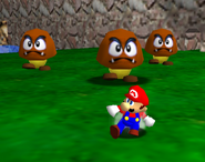 A group of three Goombas, as they appear alongside Mario in huge mode of Tiny-Huge Island
