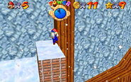 Mario and the baby penguin Tuxie as they appear in the original Super Mario 64 shortly after Mario collects the child.