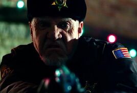 Malcolm McDowell as Sheriff James Cooper - Silent Night
