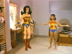 Wonder Woman with a girl in Wonder Woman underoos