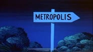 A road sign shows the way to Metropolis The Iron Eater