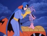 Batgirl kissing Bat-Mite