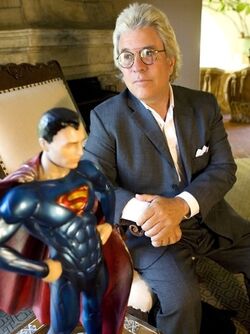 Peters poses with a  maquette.