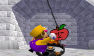 Wario tries to get the apple.