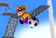 Wario gets launched into space by the soccer ball.