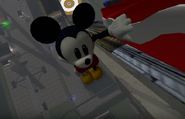 Mickey hanging onto a roller coaster.