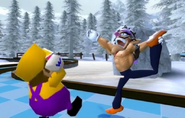 Walurambo poses, knocking Wario out.