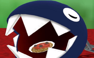 A Chain Chomp eating spaghetti.