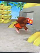 Screenshot of GonGon walking up to the banana house trying to get inside it