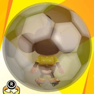 AiAi wearing F sunglasses, a yellow polka dot shirt, yellow roller blades, and in a soccer ball ball (back view)
