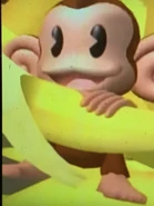 Screenshot of AiAi sitting while eating a banana