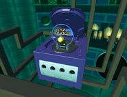 SMB2 MX10 opened.png (1.1 MB) The goal popping out of the GameCube's disc tray
