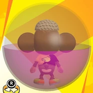 AiAi wearing a beige banana monogram cap, a black and yellow bi-color banana shirt, yellow low-cut low-tech sneakers, and in a purple ball (back view)