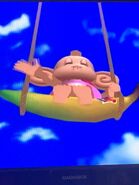 Screenshot of MeeMee waving as the swing rises