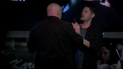 Dean shoves a man off the stage when the man tries to usher him away