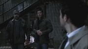 Castiel looks over to Dean