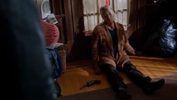 Suzie killed herself using a gun while under the Wether Box's curse
